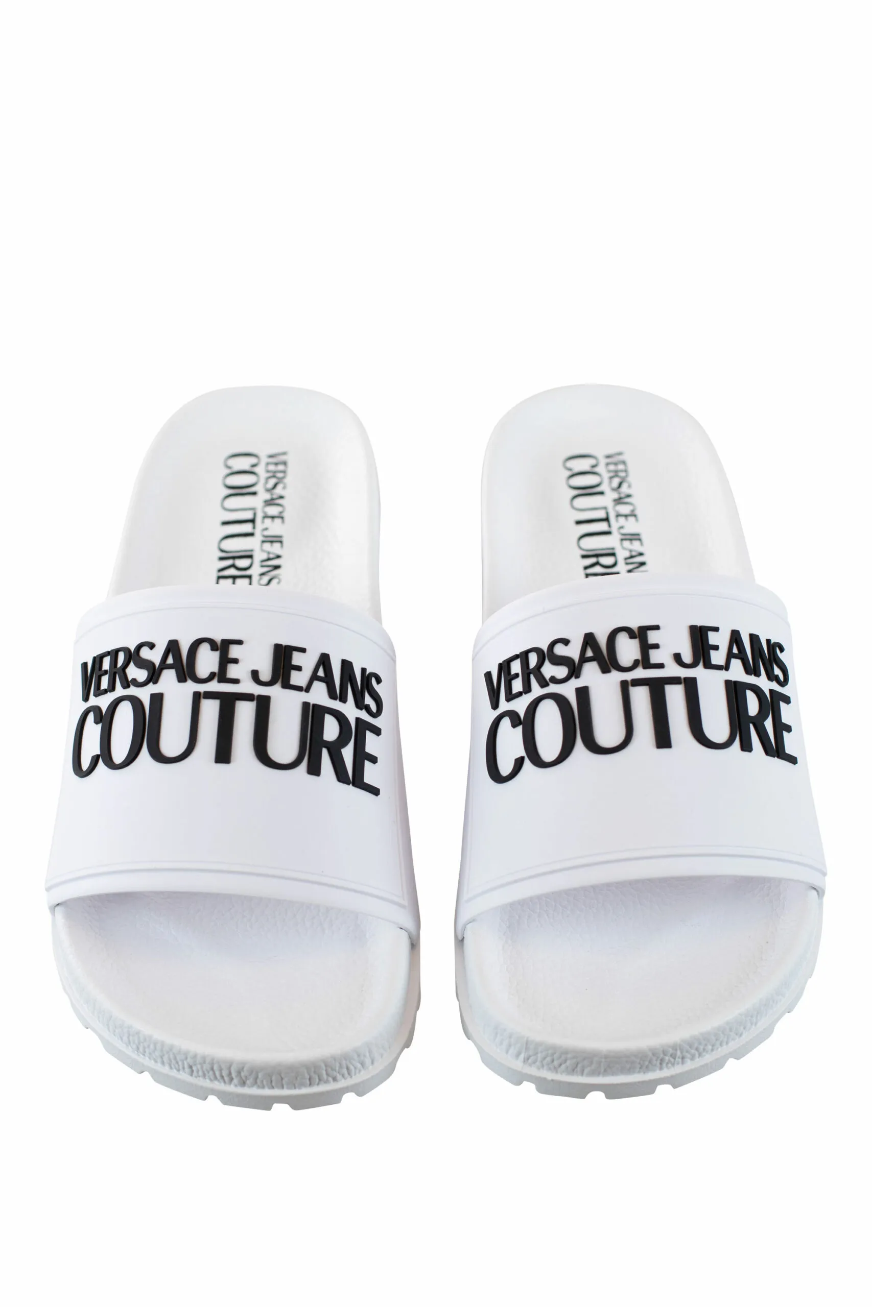 Chanclas blancas con logo y suela rugosa