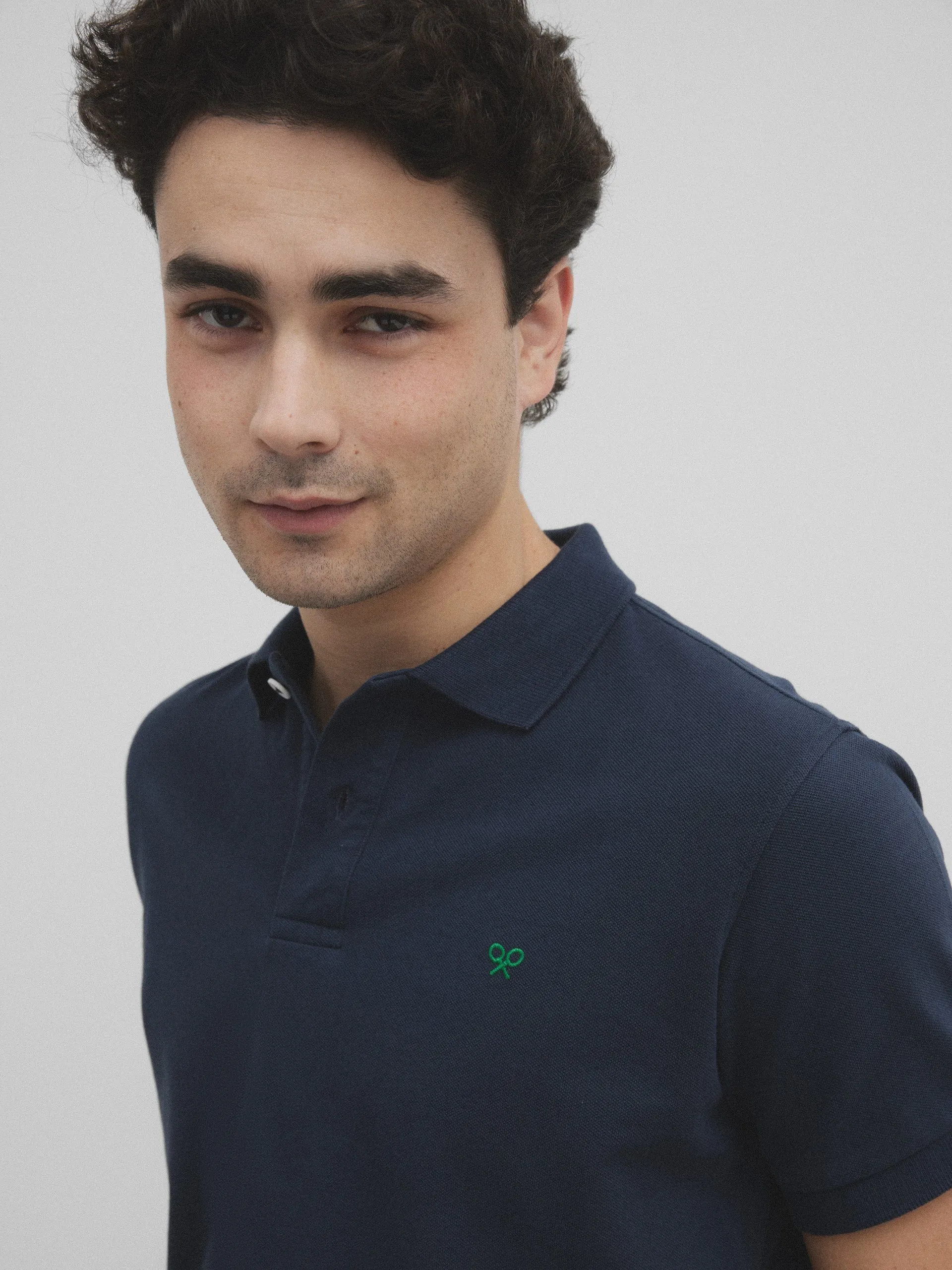 Polo raqueta blanquiverde azul marino