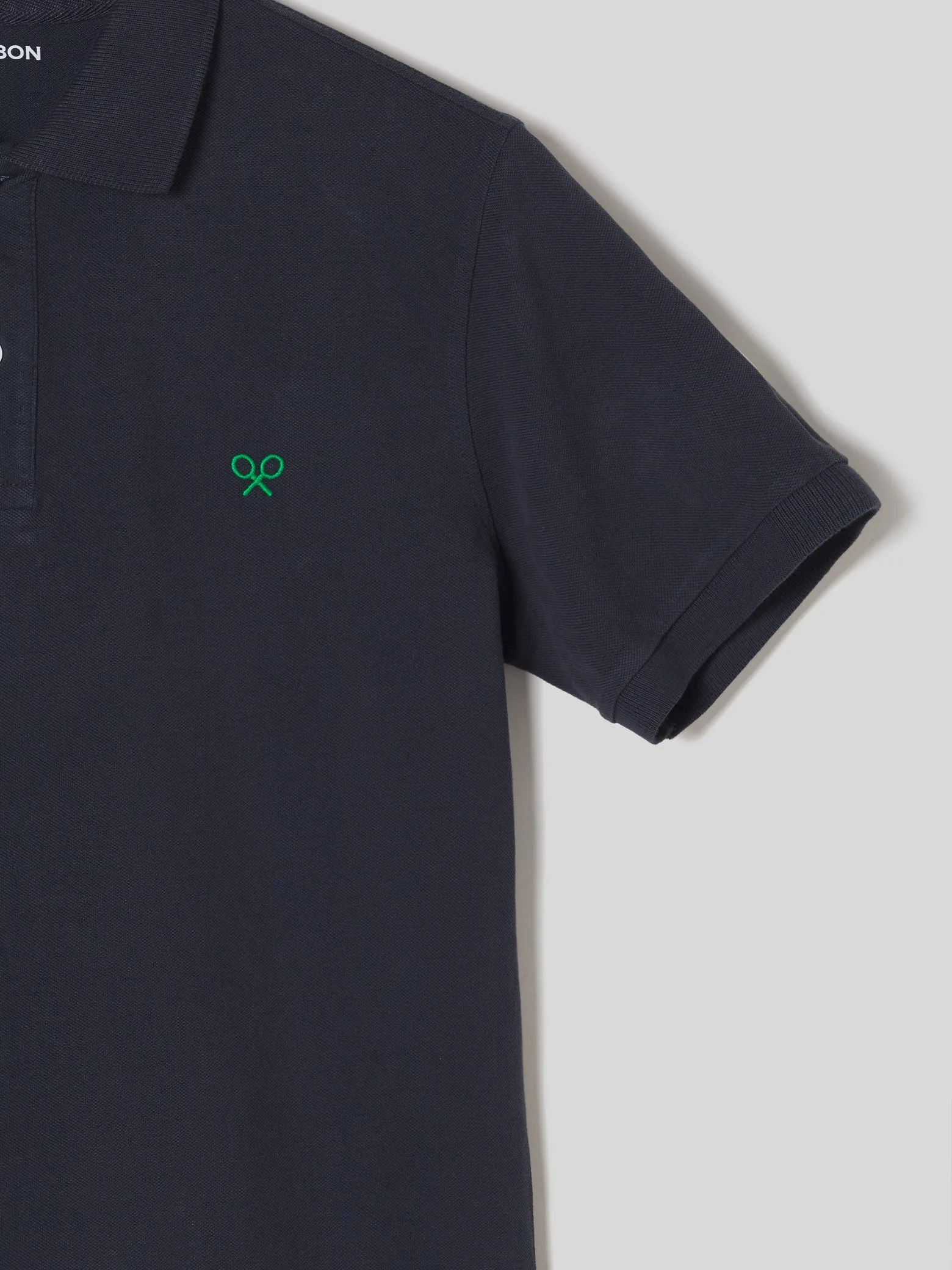 Polo raqueta blanquiverde azul marino